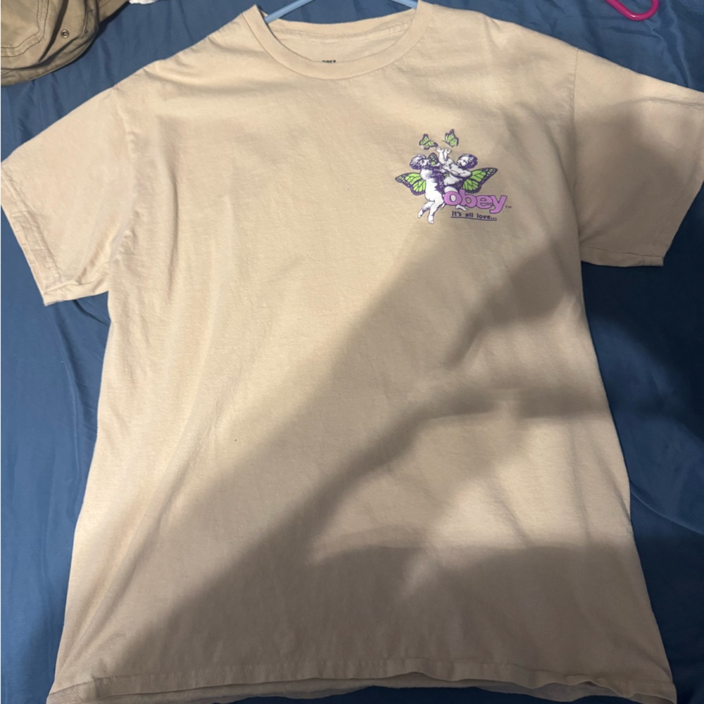 Obey Beige Short Sleeve Tee with Purple Graphic